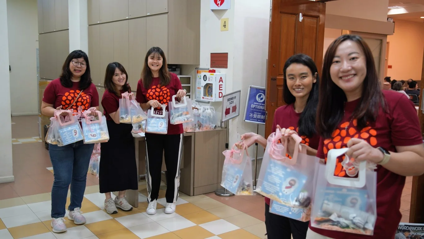 Handing out of Goodie Bags for Chang Qing Outreach