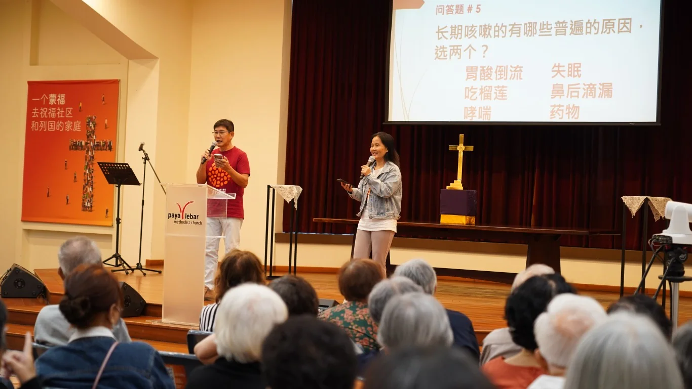 Speaker Presenting at the Chang Qing Outreach